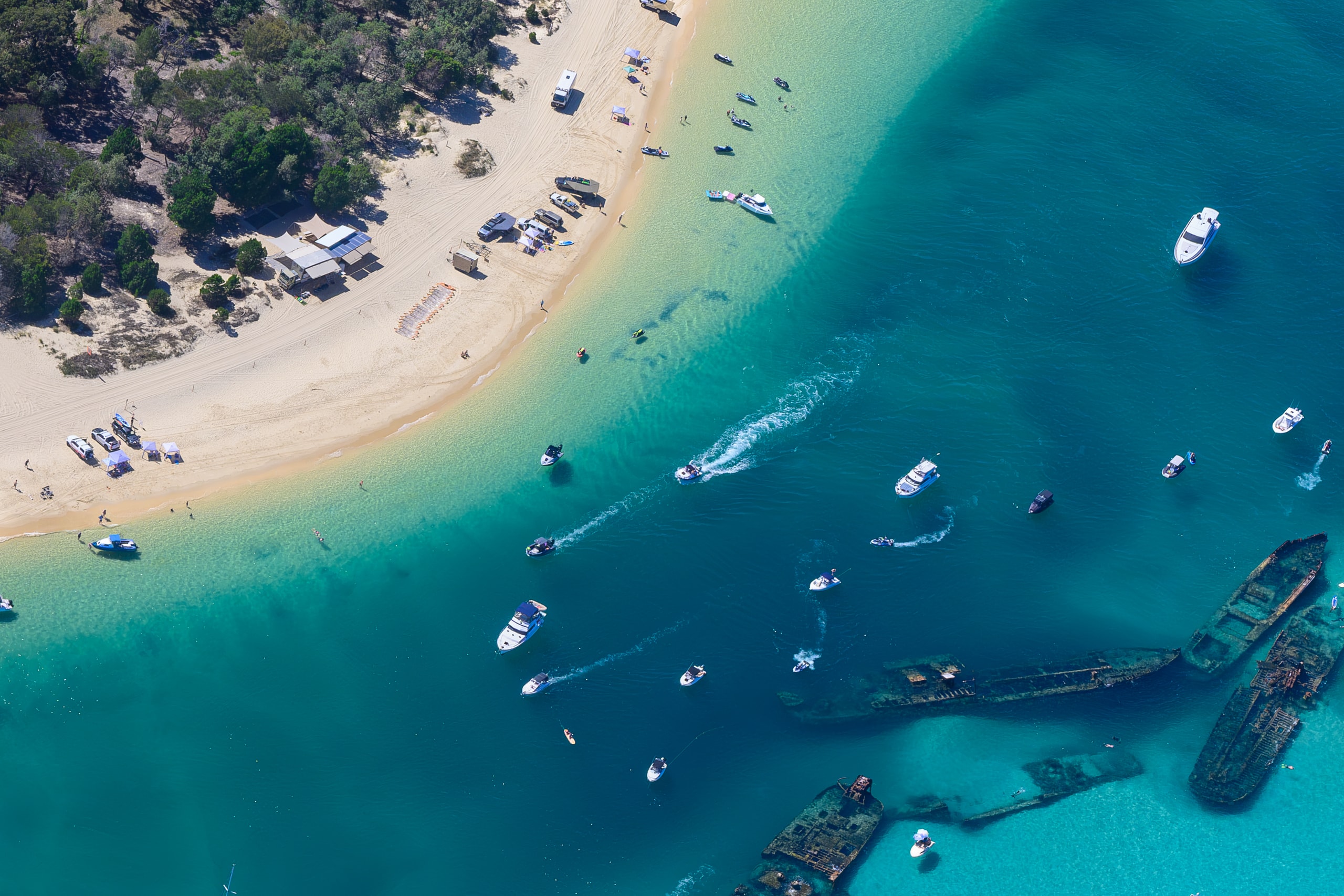 A view over the Tangalooma Wrecks at Moreton, my camera stuck nervously out the window of the plane.